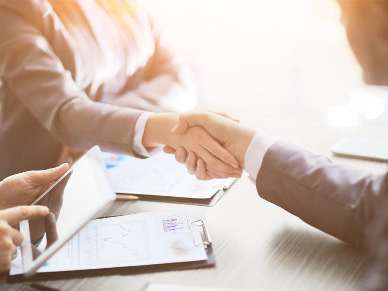 Business people shaking hands, finishing up a meeting